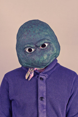 49347180-creepy-bald-lizard-man-wearing-a-blue-sweater
