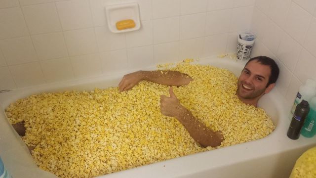 guy-in-bath-full-of-popcorn-corn-13817711991